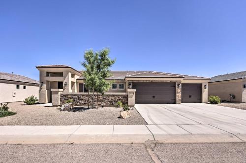 a large house with a tree in the driveway at Idyllic Kingman Retreat with Yard - Near Hiking in Kingman