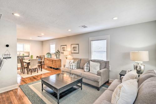 a living room with a couch and a table at about 1 Mi to Pier and Beaches! Family Home in Galveston in Galveston