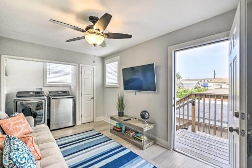 a living room with a couch and a ceiling fan at about 1 Mi to Pier and Beaches! Family Home in Galveston in Galveston