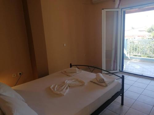 Ένα ή περισσότερα κρεβάτια σε δωμάτιο στο Mavretas Apartments 1