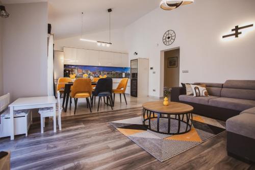 a living room with a couch and a table at Luxury house Lucija in Dugi Rat