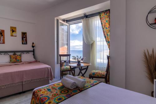 Postel nebo postele na pokoji v ubytování Bozcaada e2 Deniz Otel