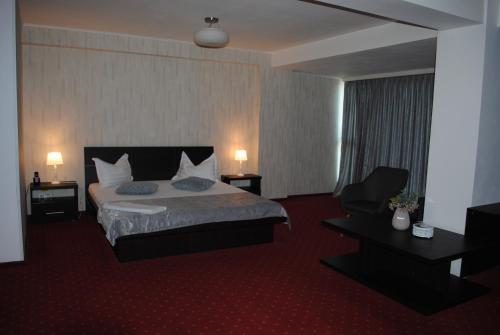 Postel nebo postele na pokoji v ubytování Hotel Corona