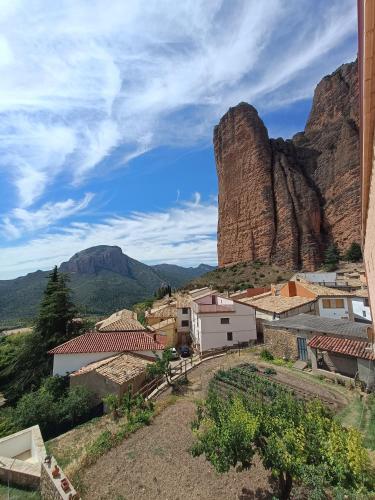 a view of a village with a mountain in the background at FIGONERO 4-6 in Las Peñas de Riglos