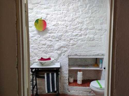 a bathroom with an apple on the wall at APPLE COTTAGE in Brynamman