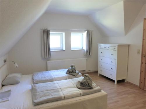 Postel nebo postele na pokoji v ubytování Ferienwohnung 6 im Böhler Haubarg