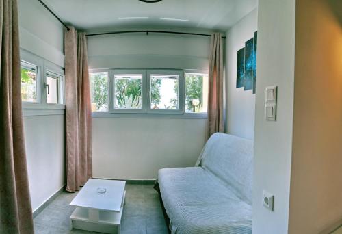 a living room with a couch and a table at Edem in Vatera