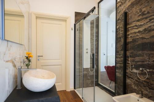 a bathroom with a large white bowl sitting on a counter at Luxury B&B La Riserva Dannunziana in Pescara