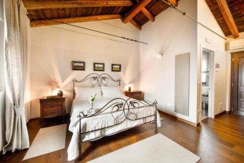 a bedroom with a white bed in a room at Orsone B&B in Gagliano