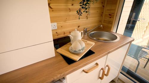 a tiny bathroom with a sink and a sinkiterator at Fine Country Stays in Bubwith