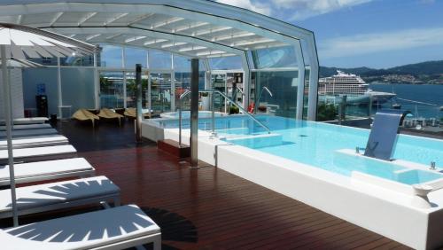 a swimming pool on the deck of a cruise ship at Gran Hotel Nagari Boutique & Spa in Vigo