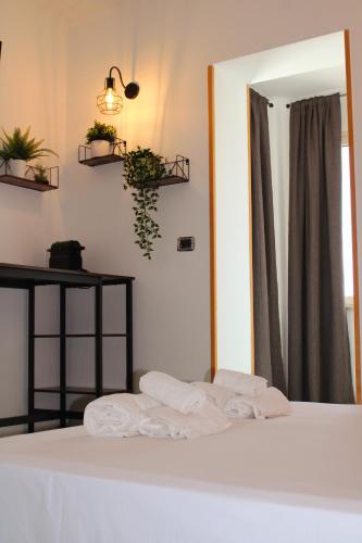 Ένα ή περισσότερα κρεβάτια σε δωμάτιο στο B&B Via Veneto