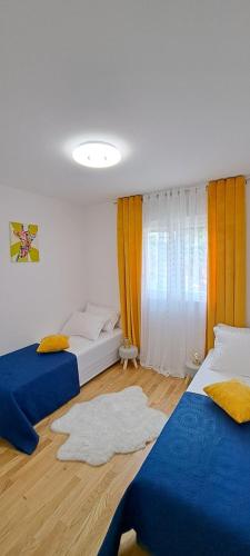 Postel nebo postele na pokoji v ubytování PALM BEACH