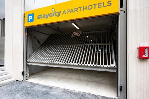 a empty bench in the entrance of a building at Staycity Aparthotels Paris La Defense in Courbevoie