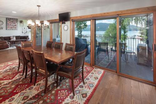 a dining room with a table and chairs at Lodge at Whitefish Lake in Whitefish