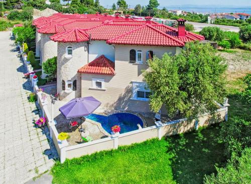 an aerial view of a house with a fence at Apartments Alexandros in Polykhrono
