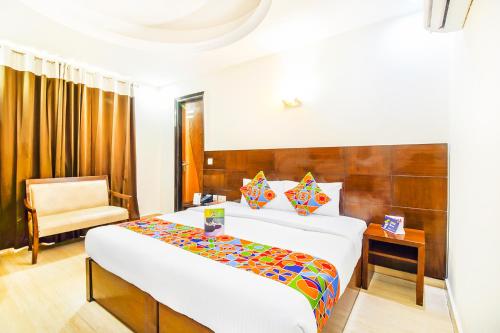 Postel nebo postele na pokoji v ubytování FabHotel Marble Arch Karol Bagh