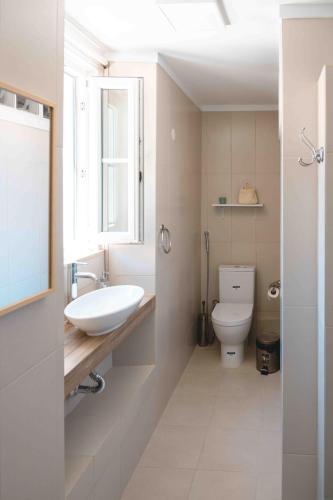 a bathroom with a sink and a toilet at Cascais Bay Hostel in Cascais