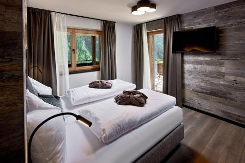מיטה או מיטות בחדר ב-Mei.Berg premium view Appartements