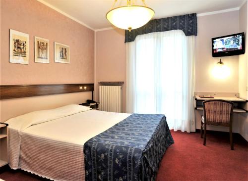 Postel nebo postele na pokoji v ubytování Bes Hotel Papa San Pellegrino Terme