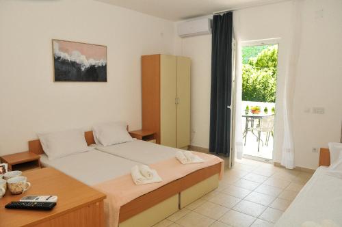 Postel nebo postele na pokoji v ubytování Guest House Marković
