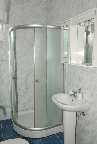 a bathroom with a shower and a sink at Guest House Marković in Budva