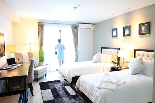 Postel nebo postele na pokoji v ubytování SN Plus Hotel - SHA Plus