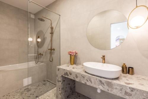 a bathroom with a sink and a mirror at Diamond Luxury Rooms in Split