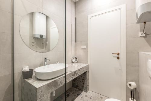 a bathroom with a sink and a mirror at Diamond Luxury Rooms in Split