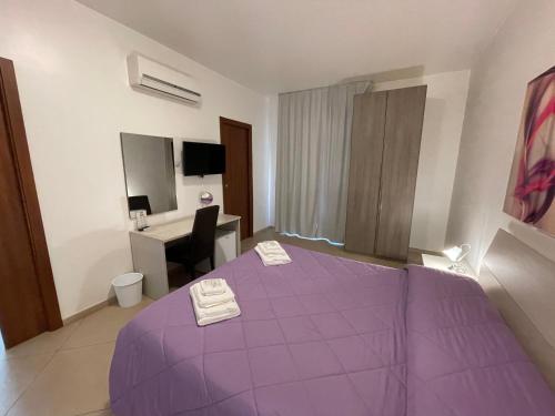 Ένα ή περισσότερα κρεβάτια σε δωμάτιο στο B&B Elisir