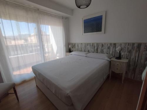 Posteľ alebo postele v izbe v ubytovaní Apartamento Victoria Plaza