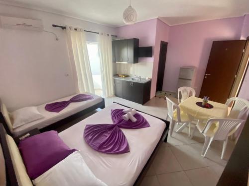 Postel nebo postele na pokoji v ubytování Hotel Vila Ali