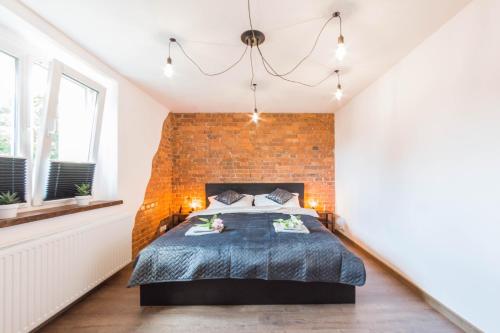 Posteľ alebo postele v izbe v ubytovaní Apartament Wita Stwosza