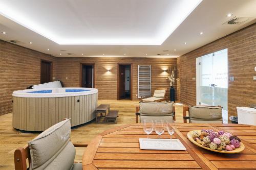 a restaurant with a table and a wellness center at Apartman Residence Moser 1504 in Karlovy Vary