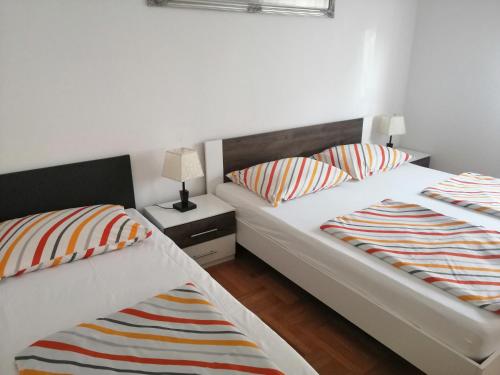 Postel nebo postele na pokoji v ubytování Apartman Mira
