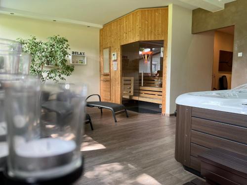 a room with a kitchen and a living room at Landferien Eifel in Pittenbach