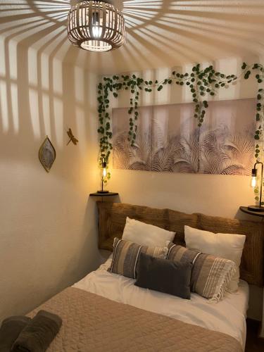 a bedroom with a bed with two pillows at Vista Mar in Empuriabrava