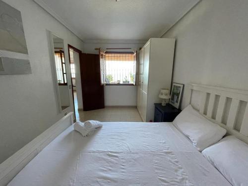 Postel nebo postele na pokoji v ubytování Alicante (Santa Pola), Vue mer & Tabarca, 4 personnes