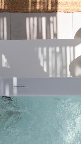 a close up of a pool of water at Kamvas Deluxe Apartments in Naxos Chora