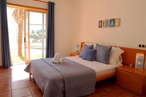 Postel nebo postele na pokoji v ubytování Casa dos Cotas