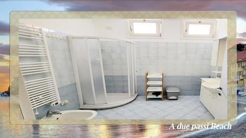 a bathroom with a shower and a sink at A due passi Beach in Sestri Levante