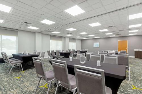 a conference room with tables and chairs in it at Best Western Plus McAllen Airport Hotel in McAllen