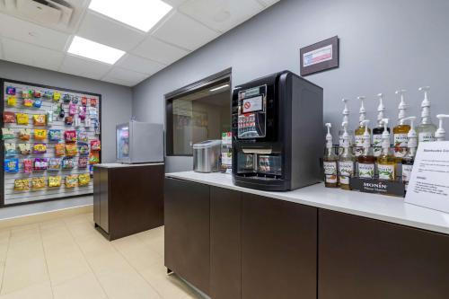 a store with a counter with a drink dispenser at Best Western Plus McAllen Airport Hotel in McAllen