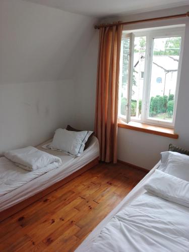 Postel nebo postele na pokoji v ubytování Wczasy Korzybie