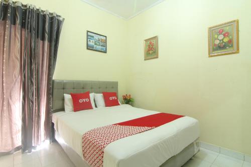 Ein Bett oder Betten in einem Zimmer der Unterkunft New Bunga Sonsang Homestay Syariah