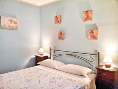 A bed or beds in a room at Assisi Casa degli Angeli