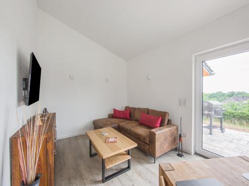Μια τηλεόραση ή/και κέντρο ψυχαγωγίας στο Ferienhaus Eifelruhe in Filz