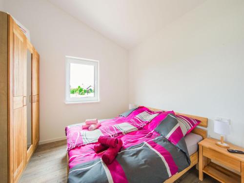 Ένα ή περισσότερα κρεβάτια σε δωμάτιο στο Ferienhaus Eifelruhe in Filz