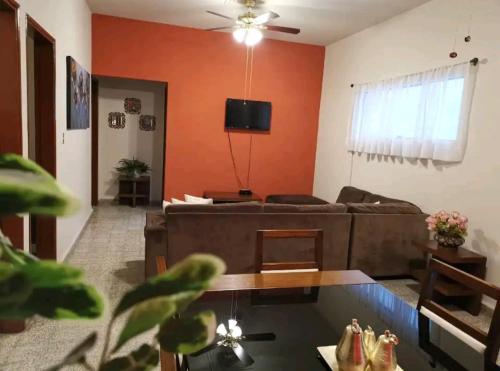 a living room with a couch and a table at Cómodo departamento in Papantla de Olarte