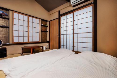 Un pat sau paturi într-o cameră la Shiki Homes SEN - Vacation STAY 03231v